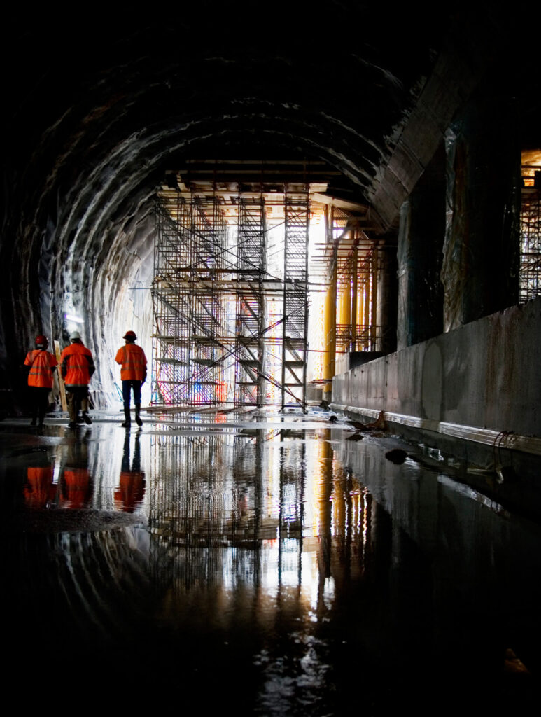 Rear view of workers at construction site